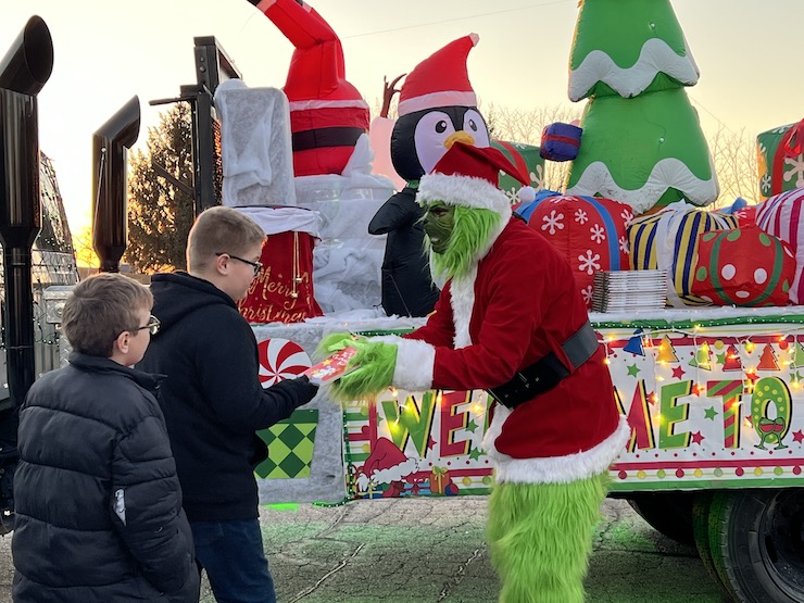 The Grinch passes out books to Edwards students 